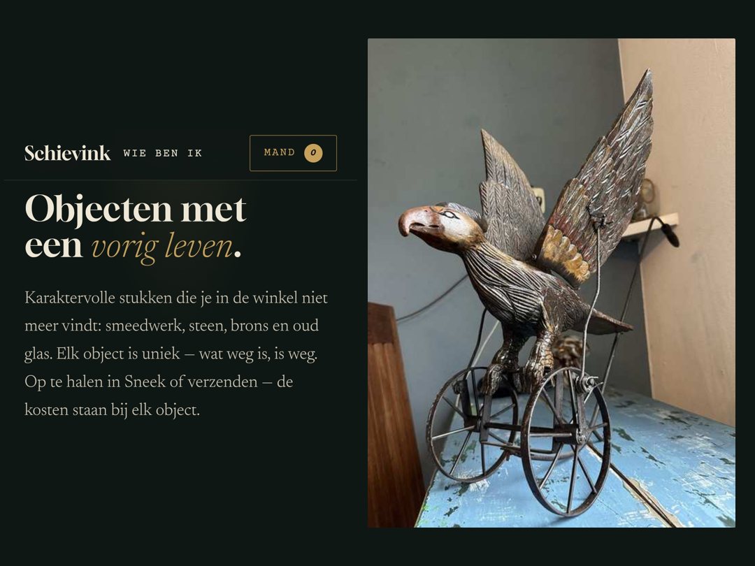 Voorpagina van schievinkantiek.nl met een houten adelaar